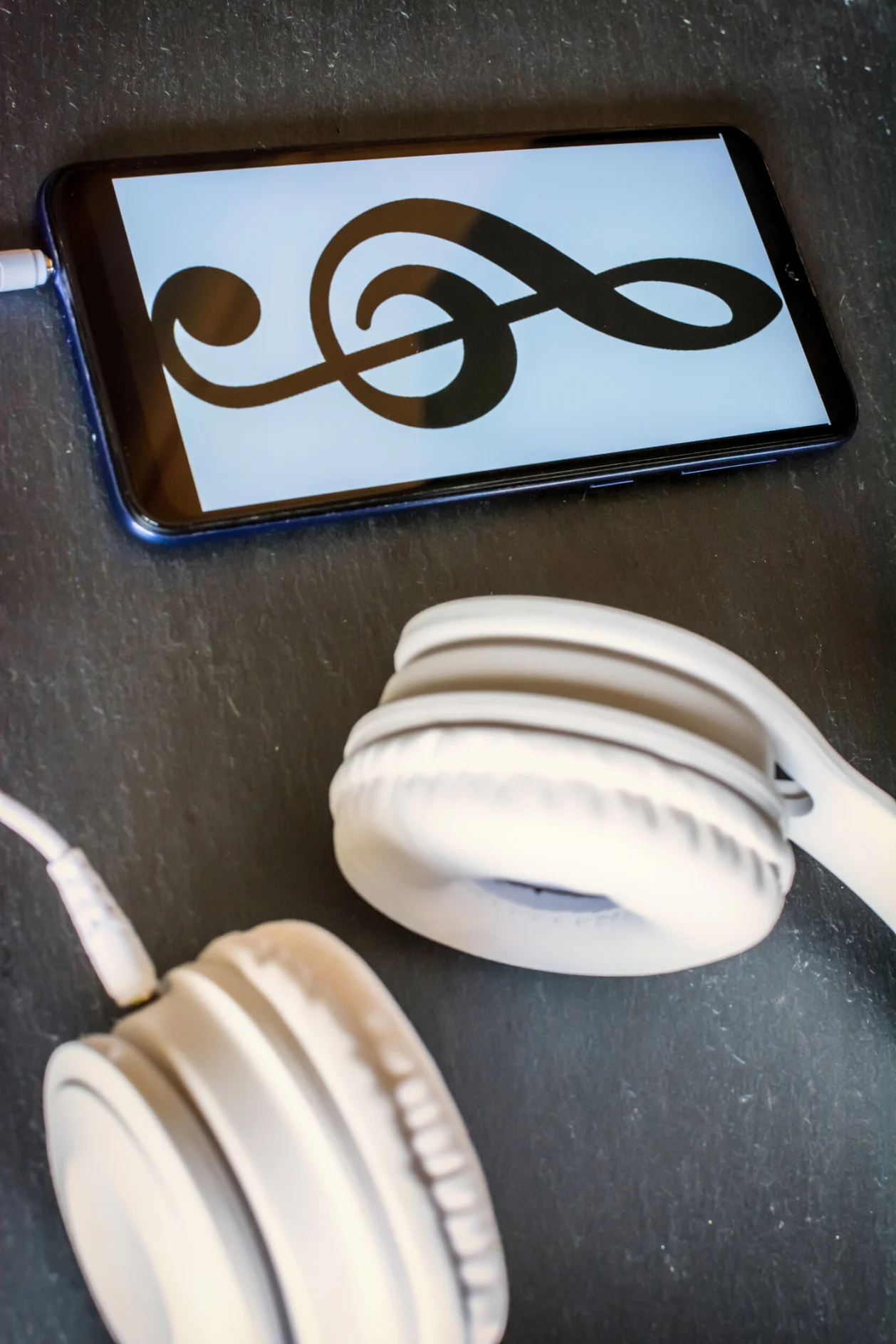 Close-up Of A Mobile With Headphones